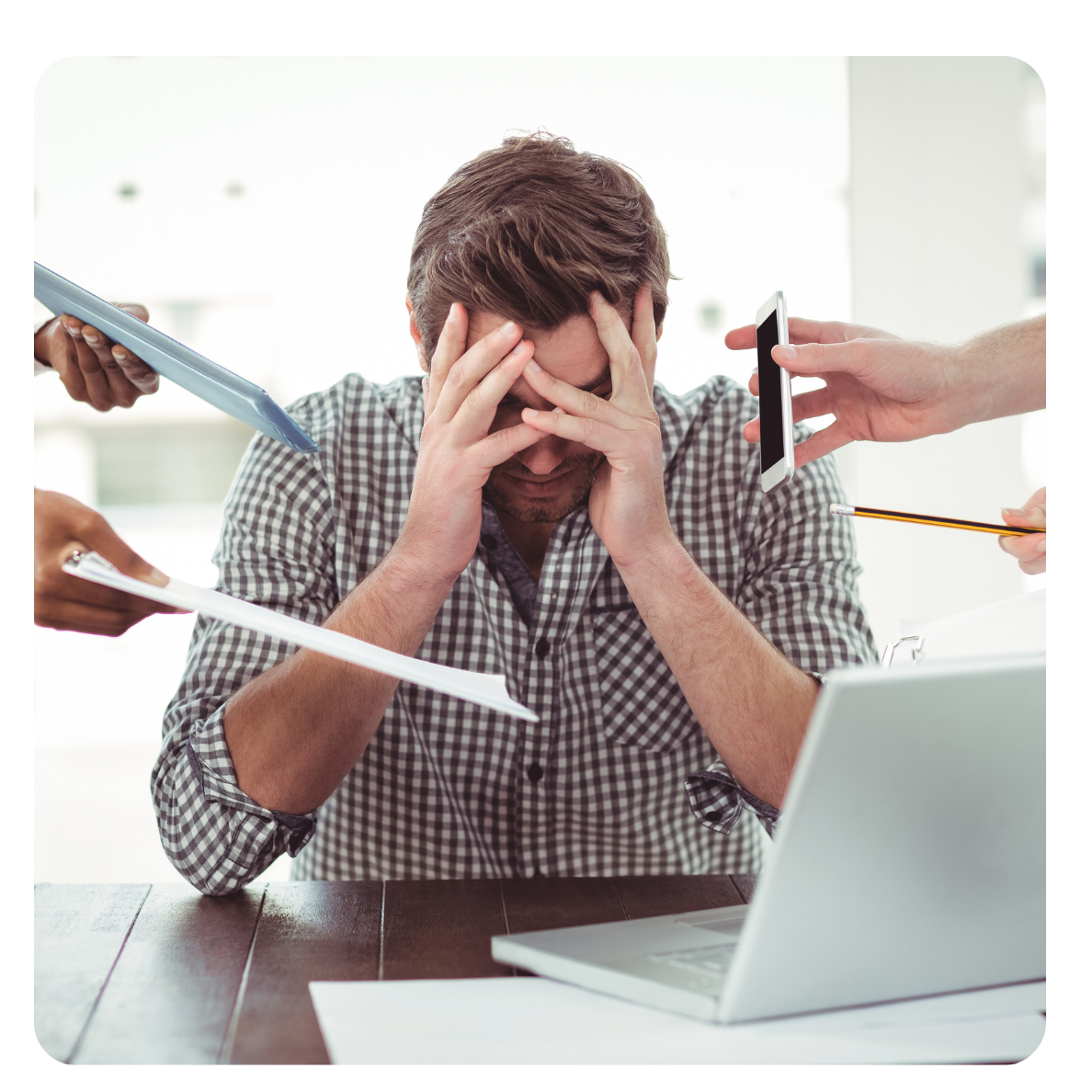 Overwhelmed professional with multiple tasks